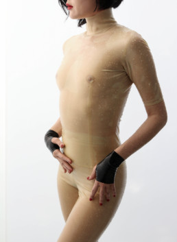 Pro domme Domina Yuki waring a latex body suit and latex gloves. She loves CFNM, bondage and total power exchange.